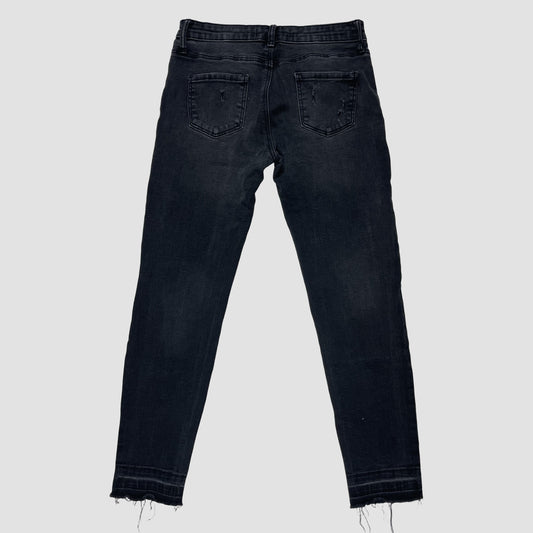 Schwarze Skinny-Jeans aus Denim mit Rissen und Fransensaum