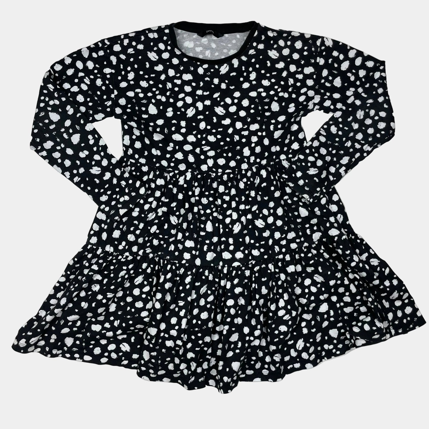 Schwarzes Baumwollkleid mit gepunktetem Muster und langen Ärmeln