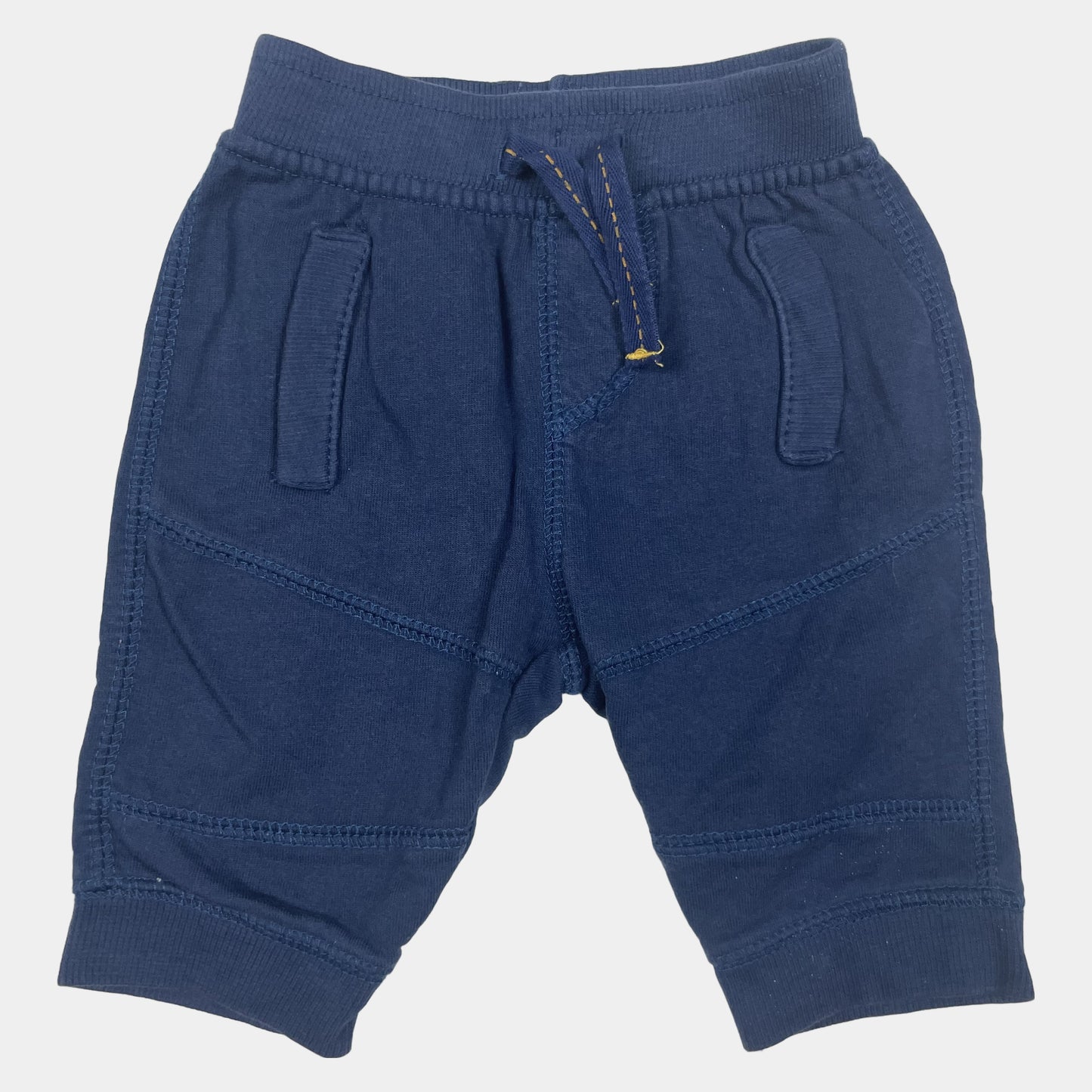 Dunkelblaue Baumwollhose mit elastischem Bund und Seitentaschen.