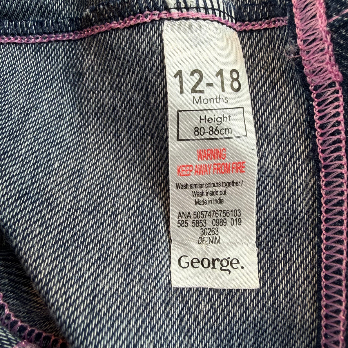 Dunkelblaue Baby-Denim-Leggings mit elastischem Bund, rosa Ziernähten und umgeschlagenen Säumen – label