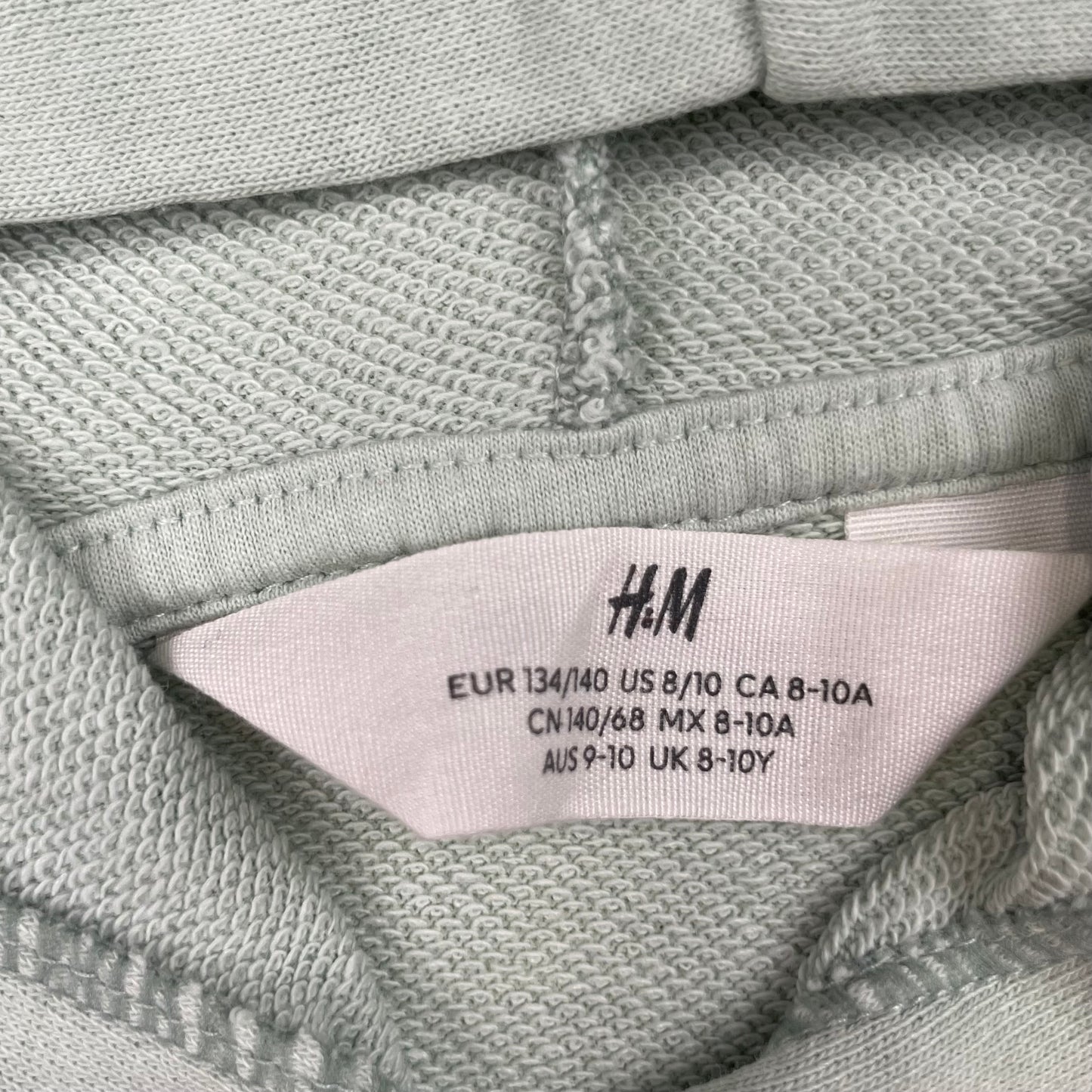 Grüner Kapuzenpullover mit Print von H&M, Größe 134/140 – label