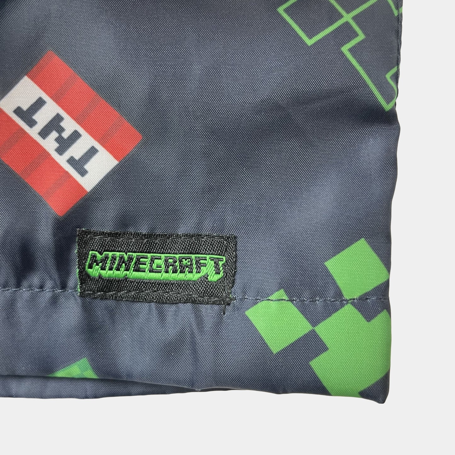 Graue Regenjacke mit grünem Muster für Jungen, Größe 8 Jahre – logo