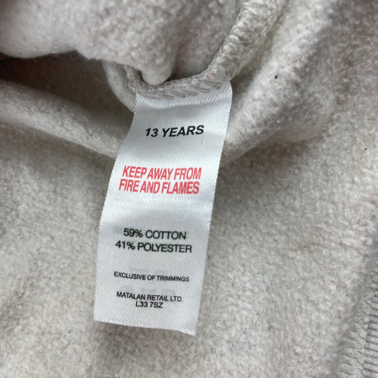 Graues Sweatshirt mit Leopardenmotiv und Schriftzug – label