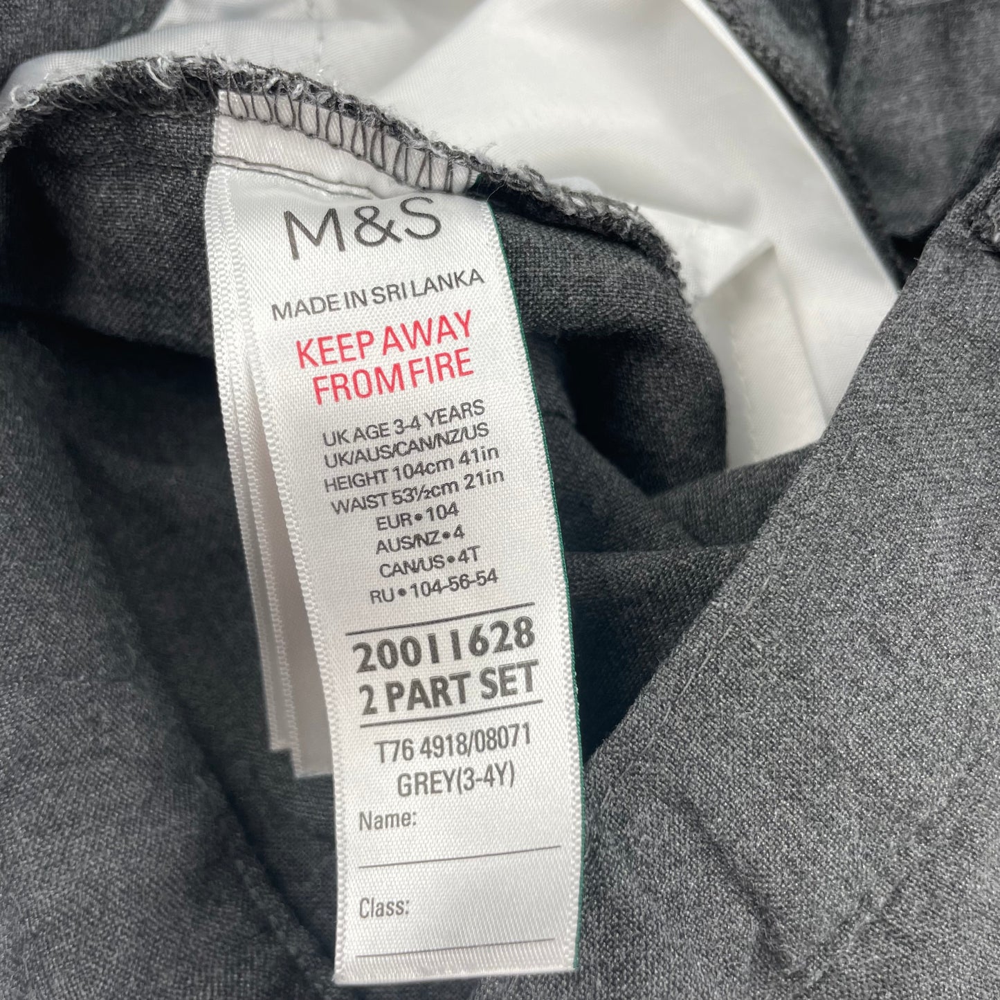 Graue Hose mit Gürtelschlaufen – label