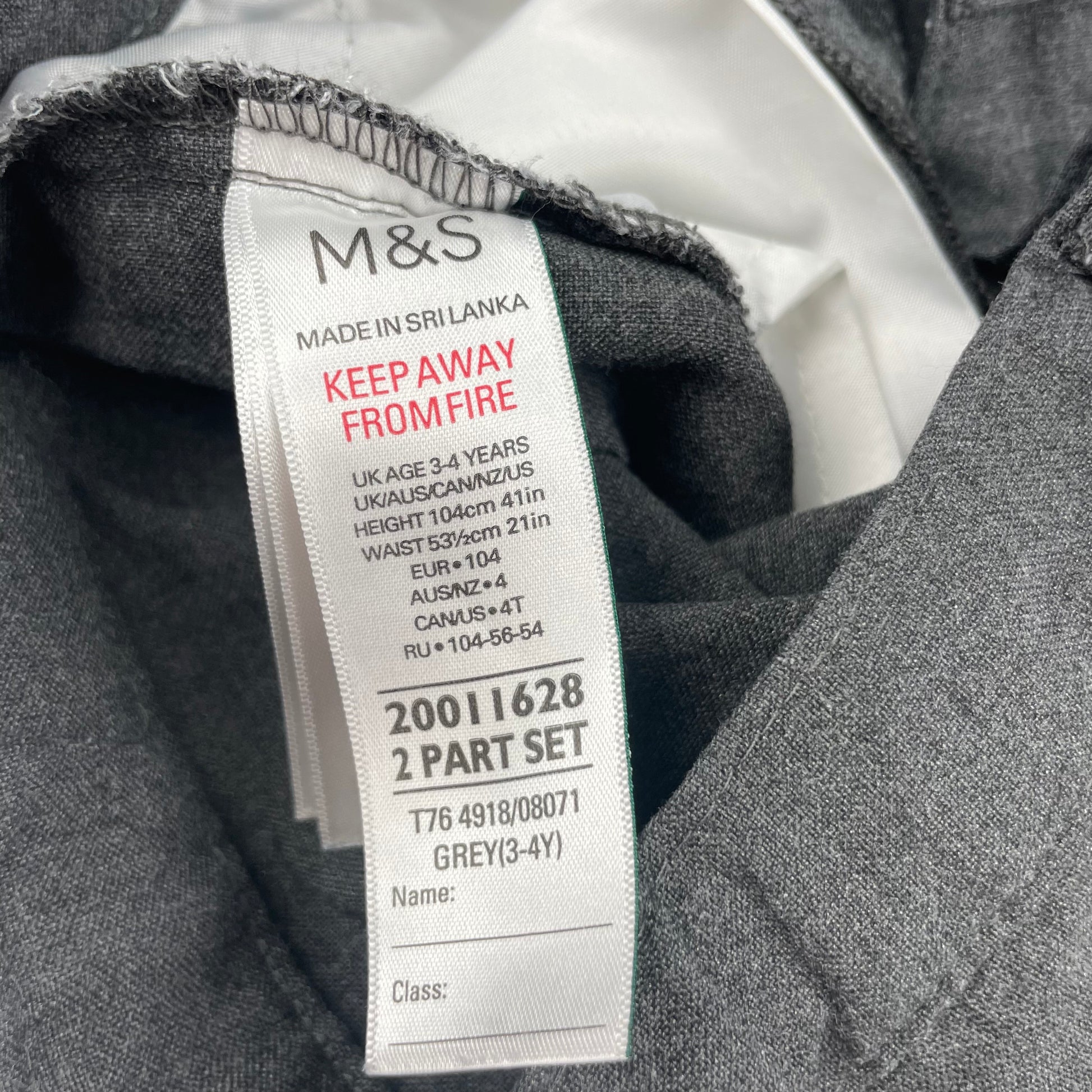 Graue Hose mit Gürtelschlaufen – label