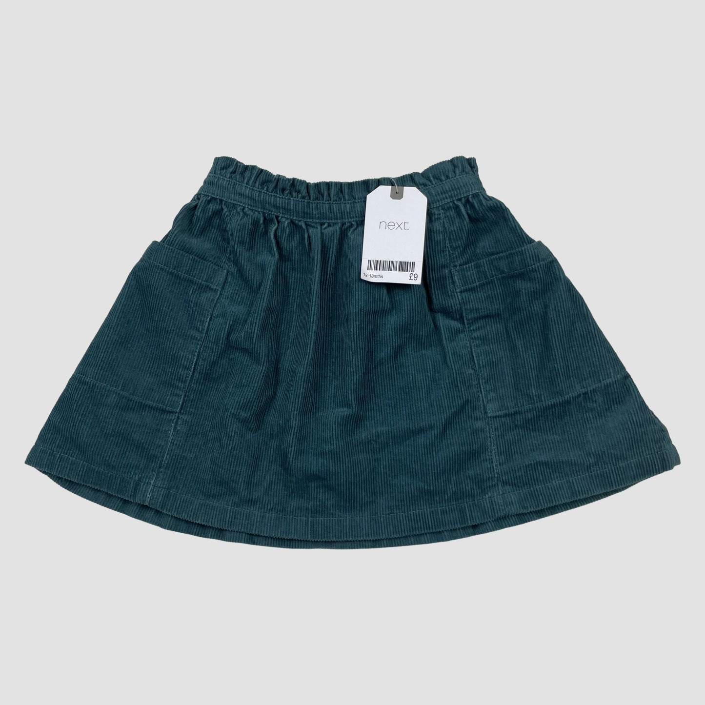 Petrolfarbener Cord-Rock von Next mit elastischem Bund und zwei aufgesetzten Taschen – detail