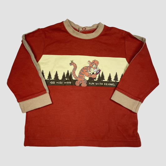 Oranges Langarmshirt von George/Disney Baby mit Tigger-Print und beigen Bündchen, Größe 9–12 Monate – front