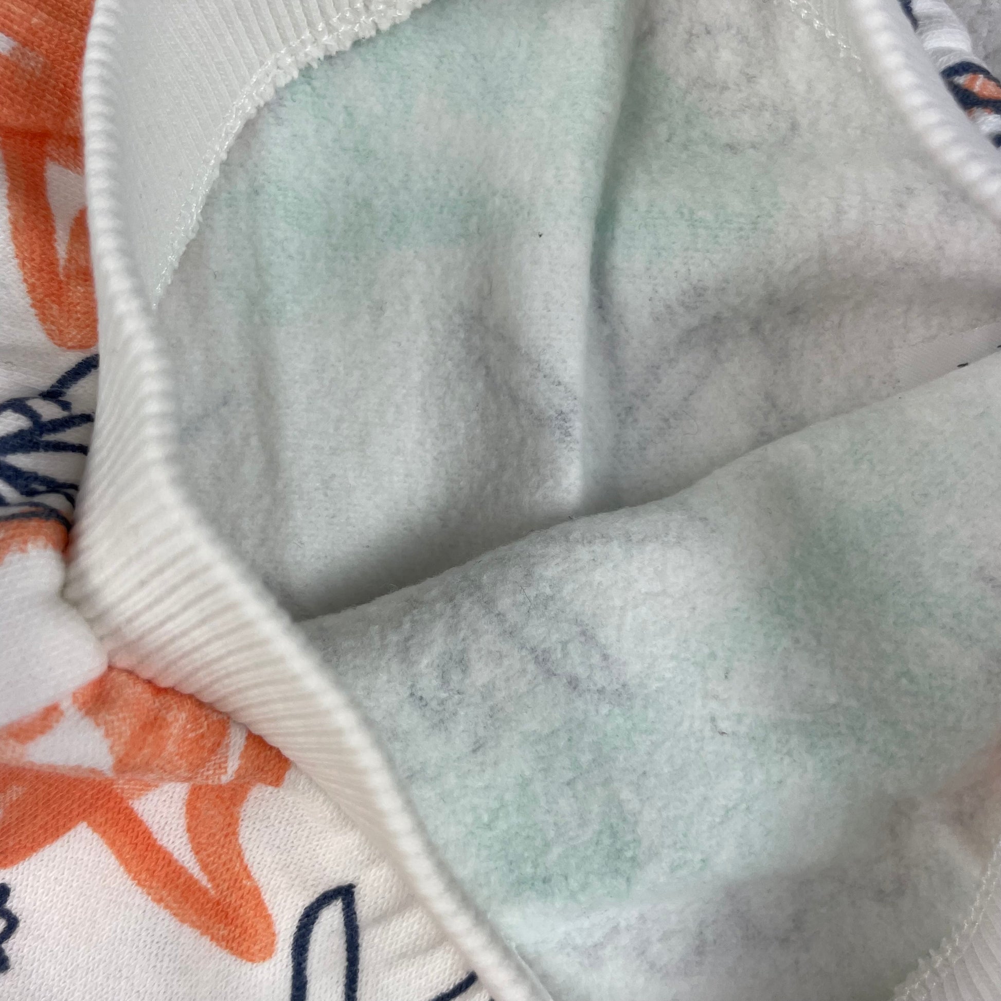 Baby Jogginghose mit Dinosaurier-Print in Weiß, Größe 3–6 Monate