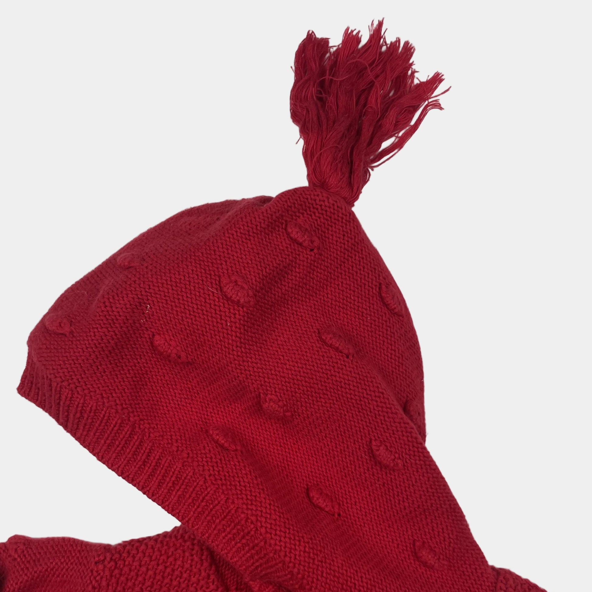Rote Kapuzen-Strickjacke mit Noppen und Quaste, Größe 6–9 Monate – detail