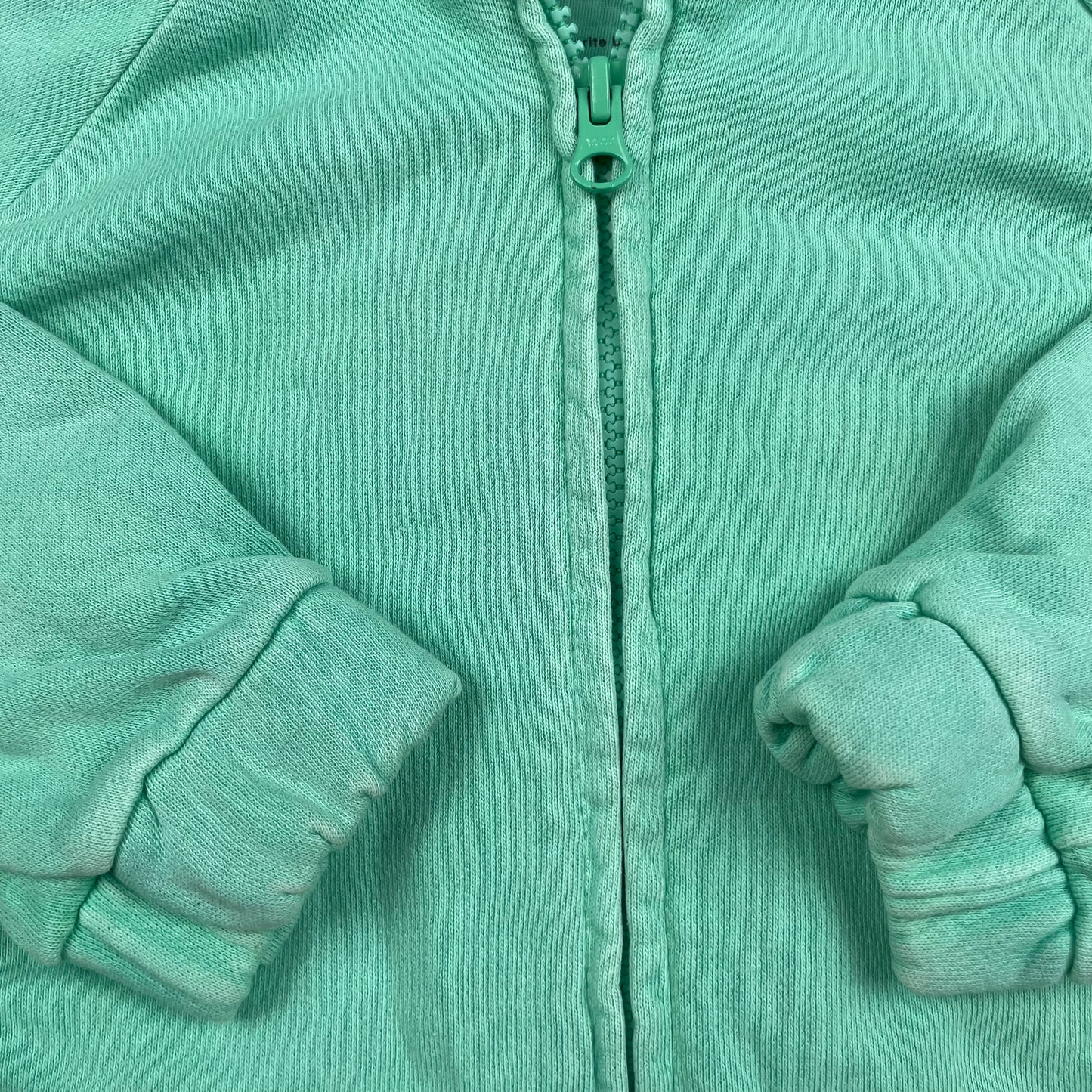 Mintgrüne Baumwolljacke mit Kapuze und elastischen Bündchen – detail