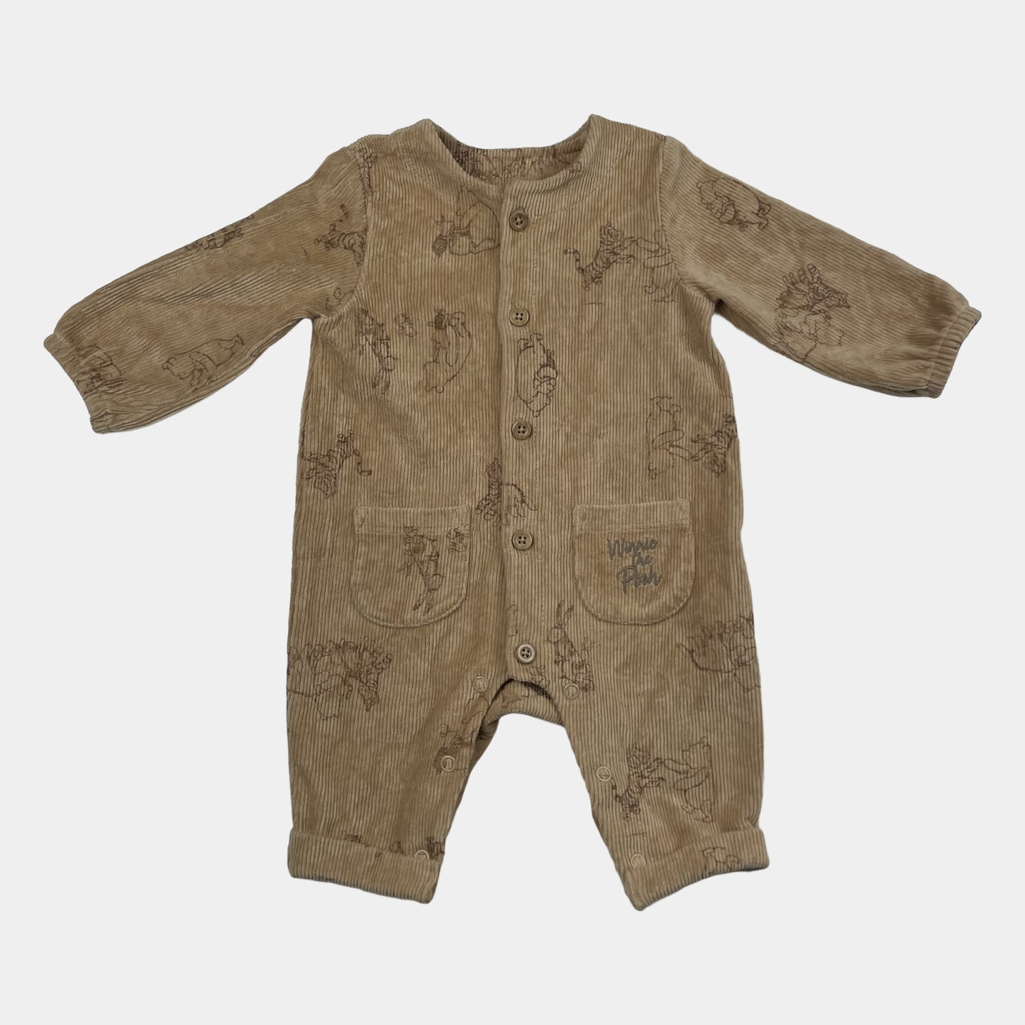 Beiger Cordoverall mit Tiermotiv und Knöpfen vorne.
