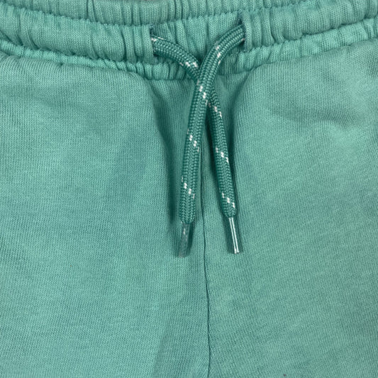 Grüne Jogginghose für Kinder mit seitlichen Dino-Details. – inside