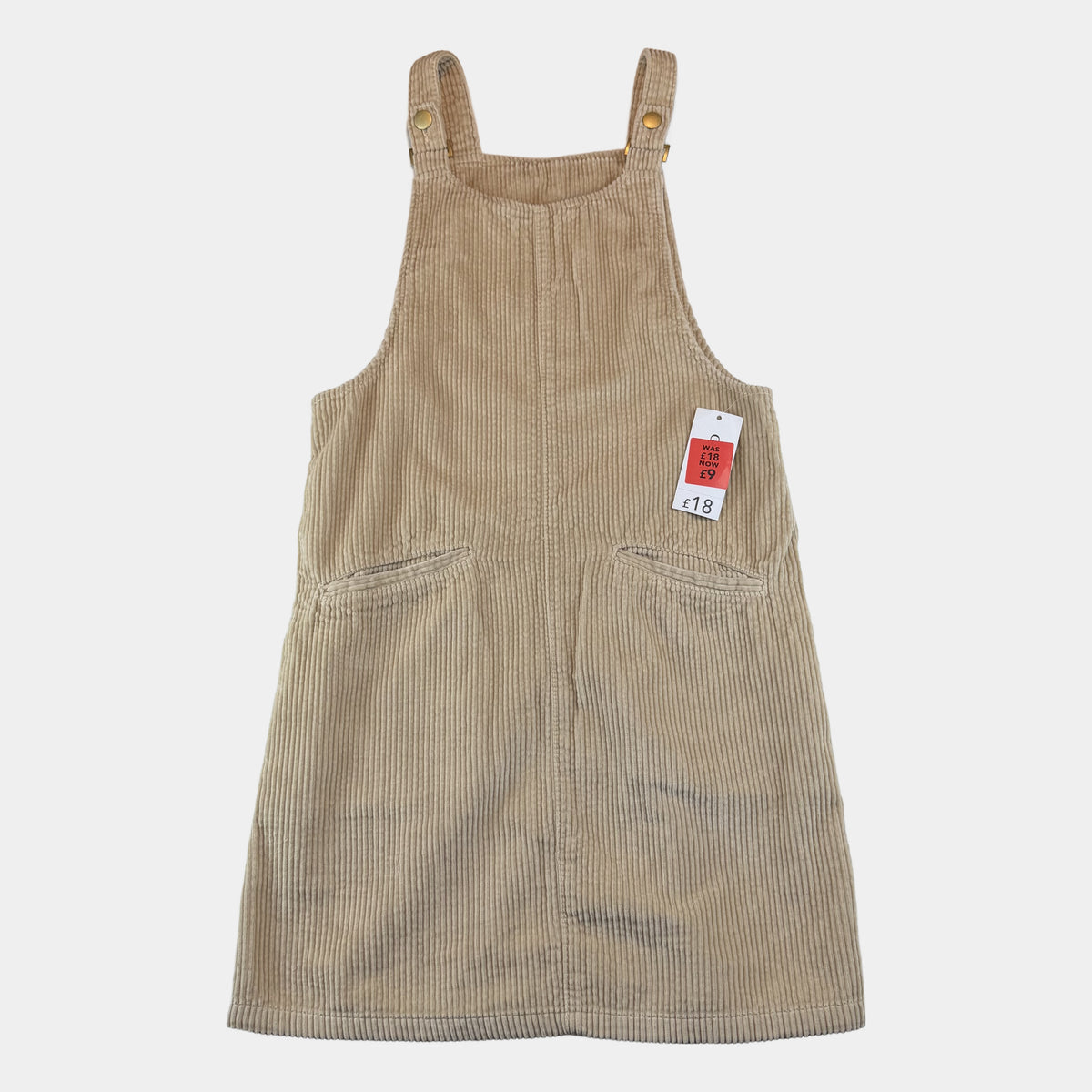 Beiges Cord-Latzkleid für Kinder mit Knopfträgern und seitlichen Taschen – front