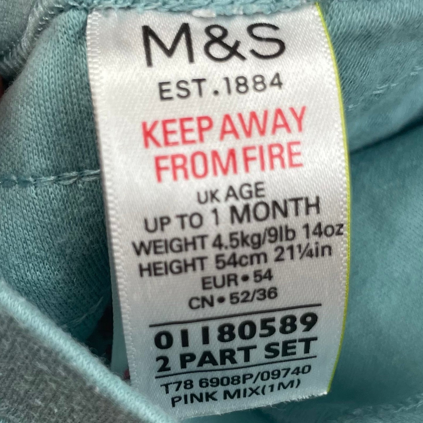 Türkise Baumwollhose mit Rüschen auf der Rückseite. label