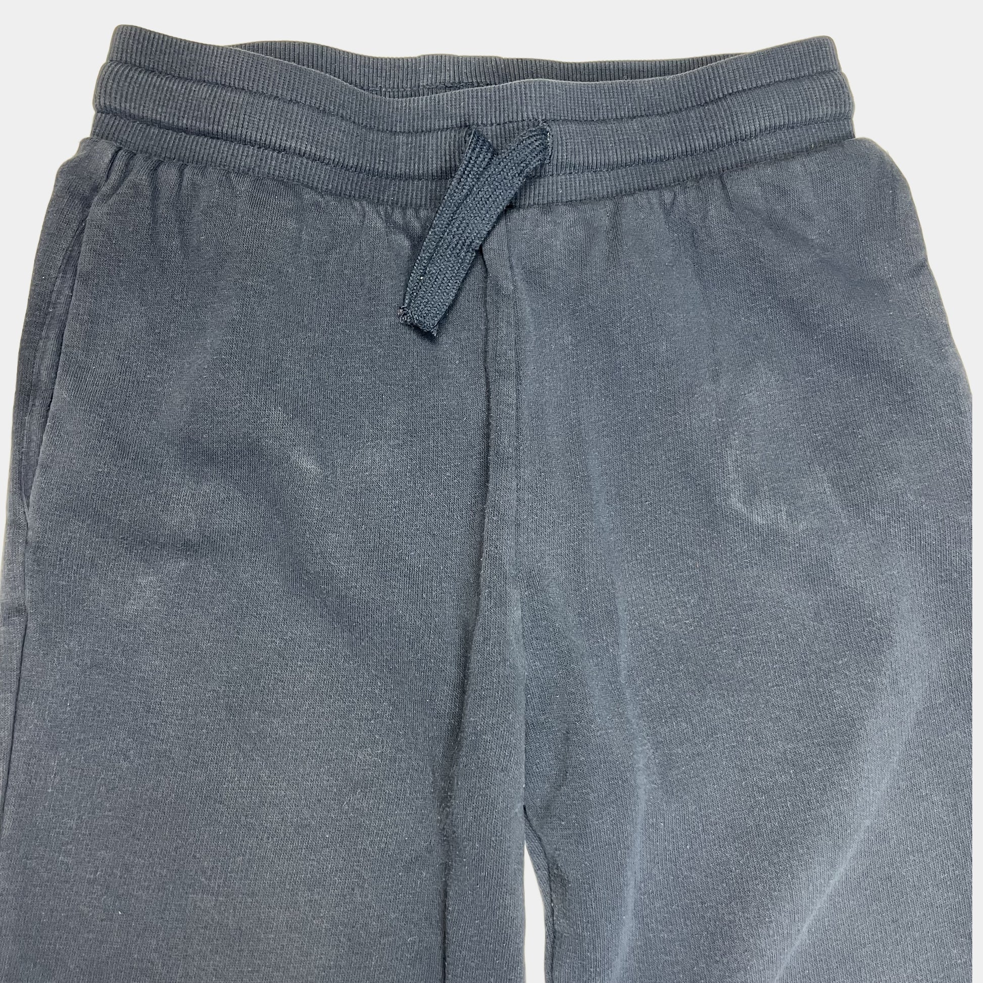 Blaue Jogginghose für Kinder mit elastischen Bündchen und Kordelzug – detail