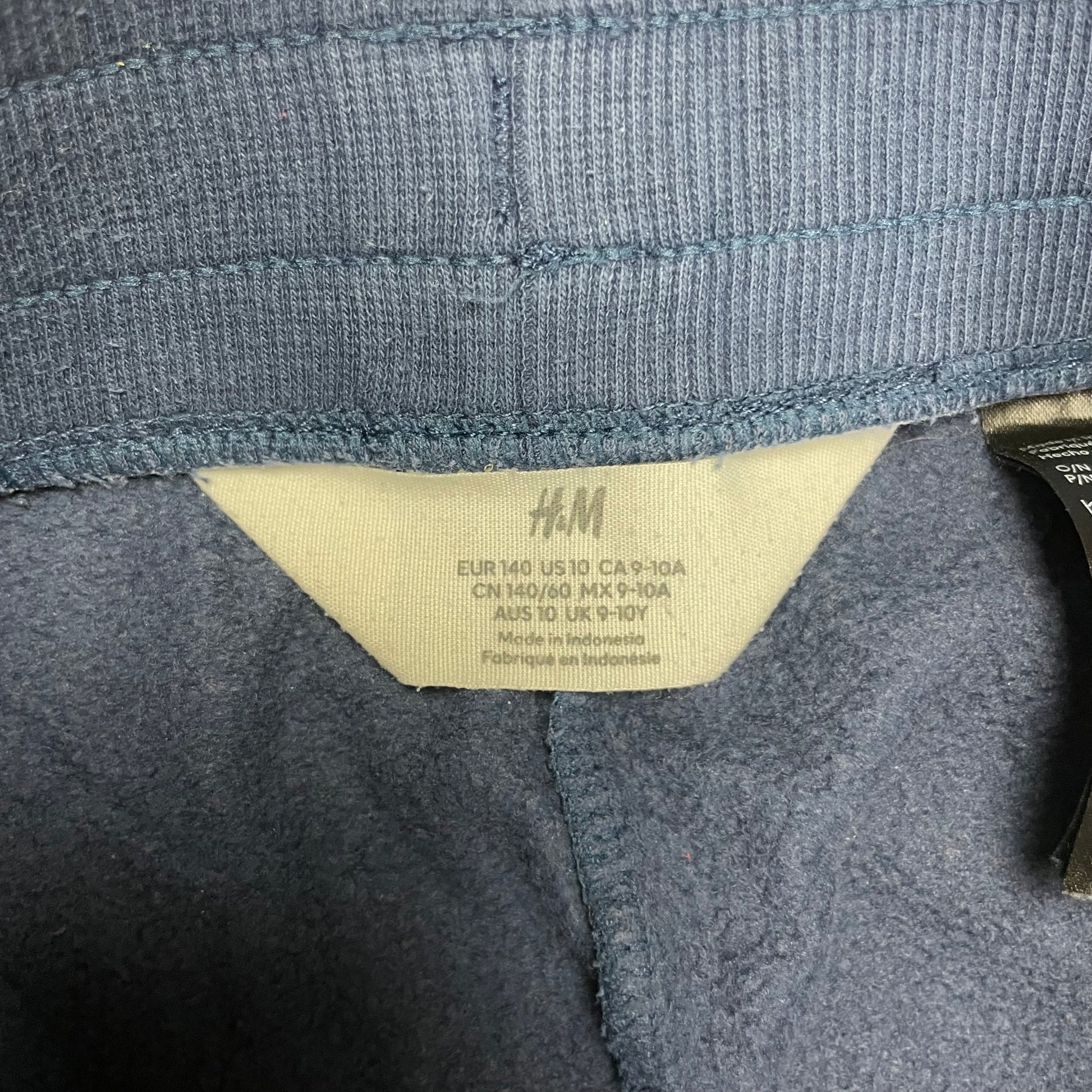 Blaue Jogginghose für Kinder mit elastischen Bündchen und Kordelzug – label