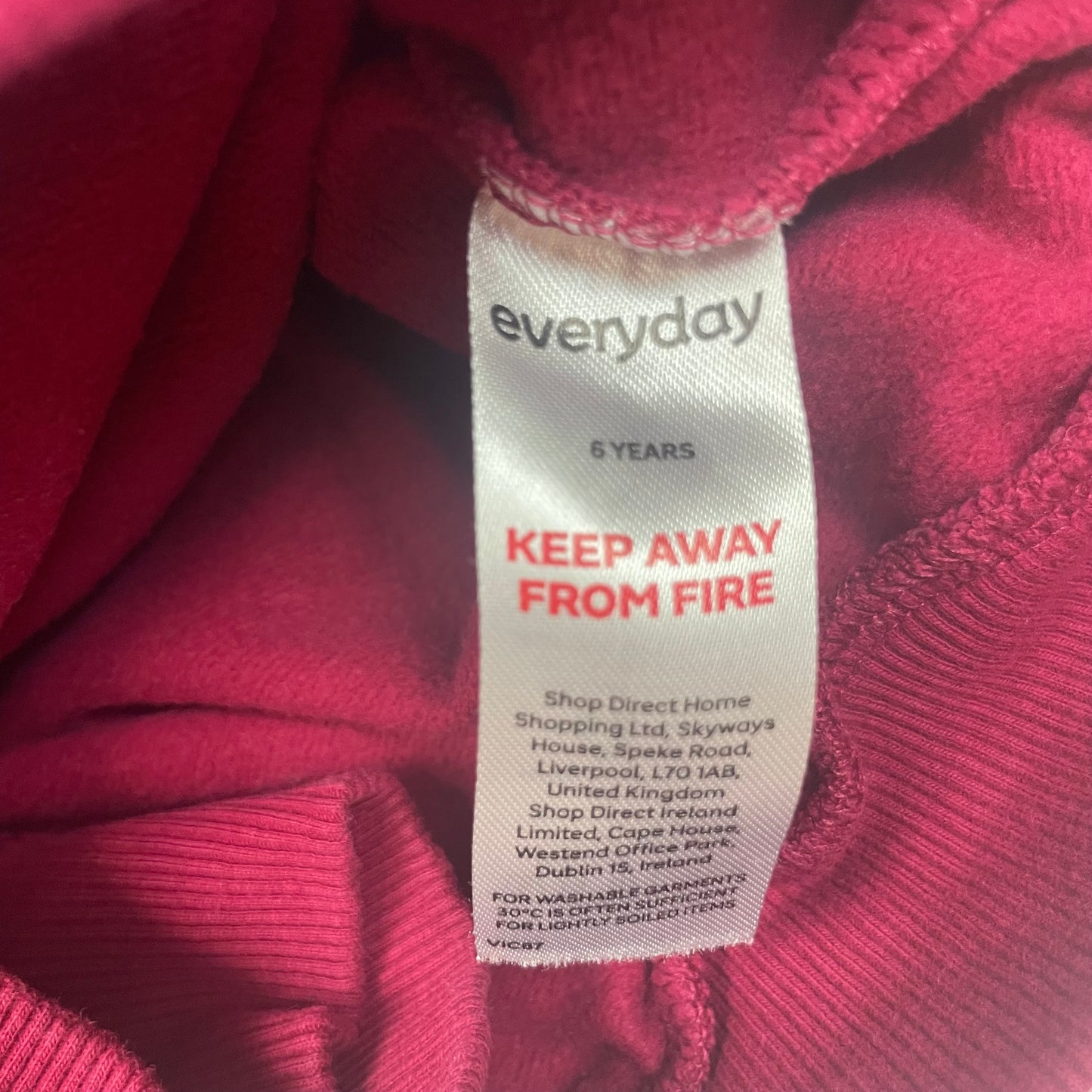 Pflaumenfarbener Pullover mit Rüsche für Kinder – label