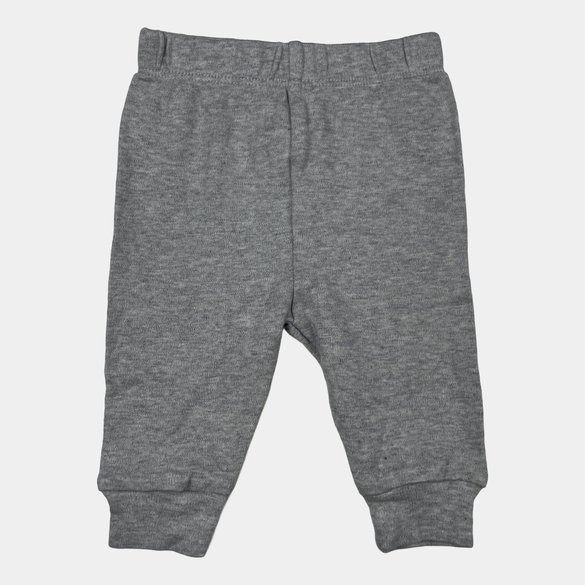 Graue Hose aus Baumwolle für Babys mit elastischem Bund und Bündchen. – front