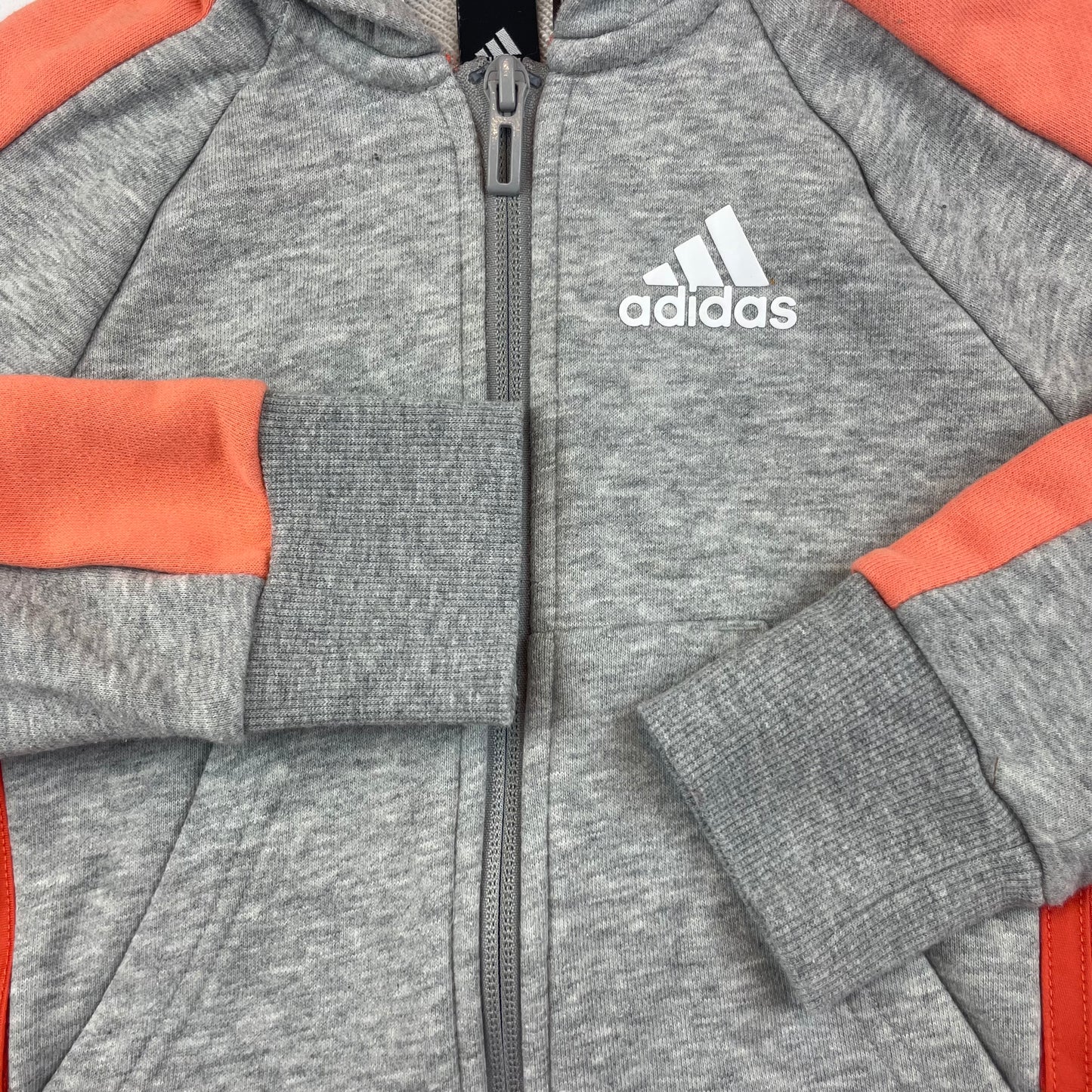 Graue und orange Kapuzenjacke von Adidas für Kinder – detail
