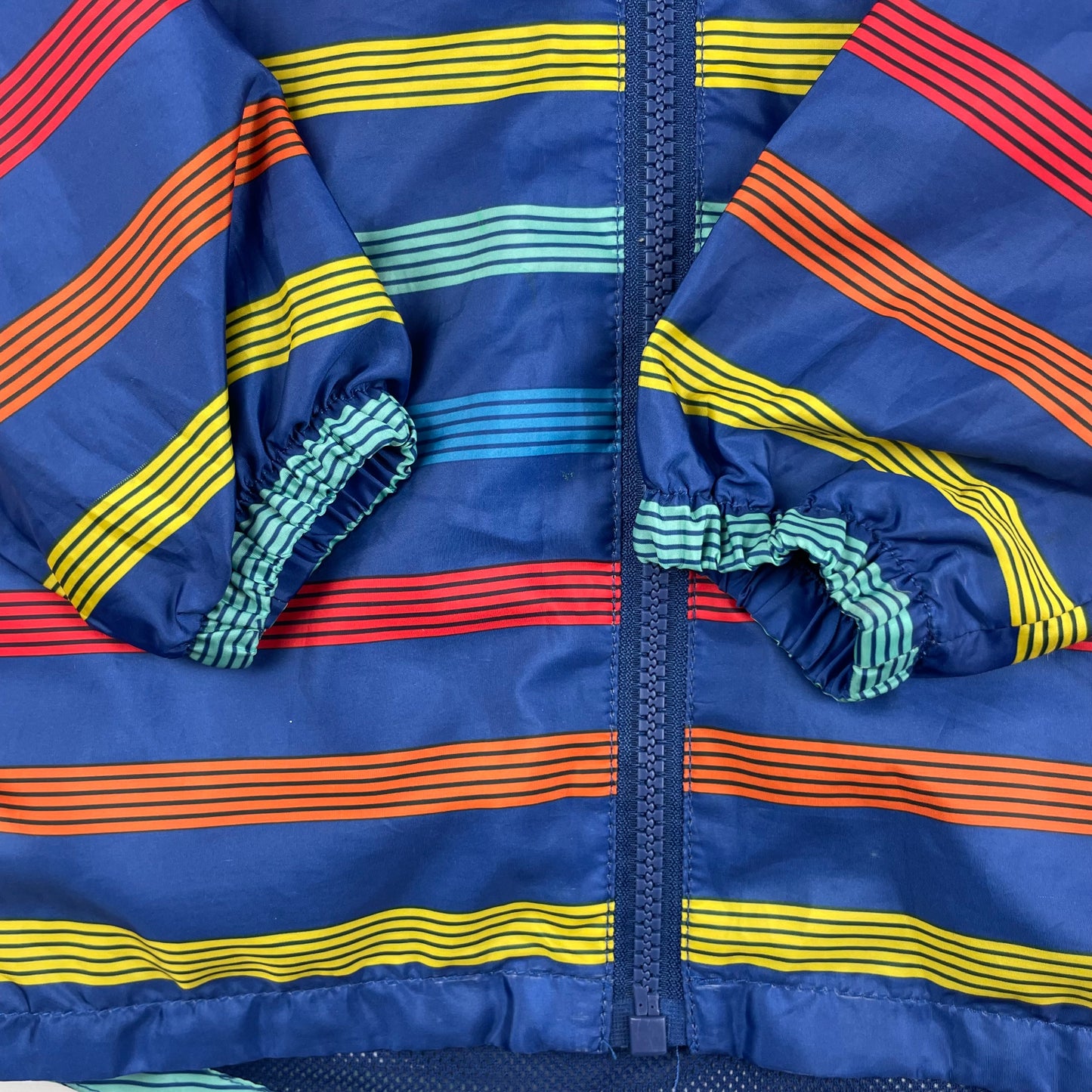 Bunte Regenjacke mit Kapuze für Kinder 12-18 Monate – sleeve
