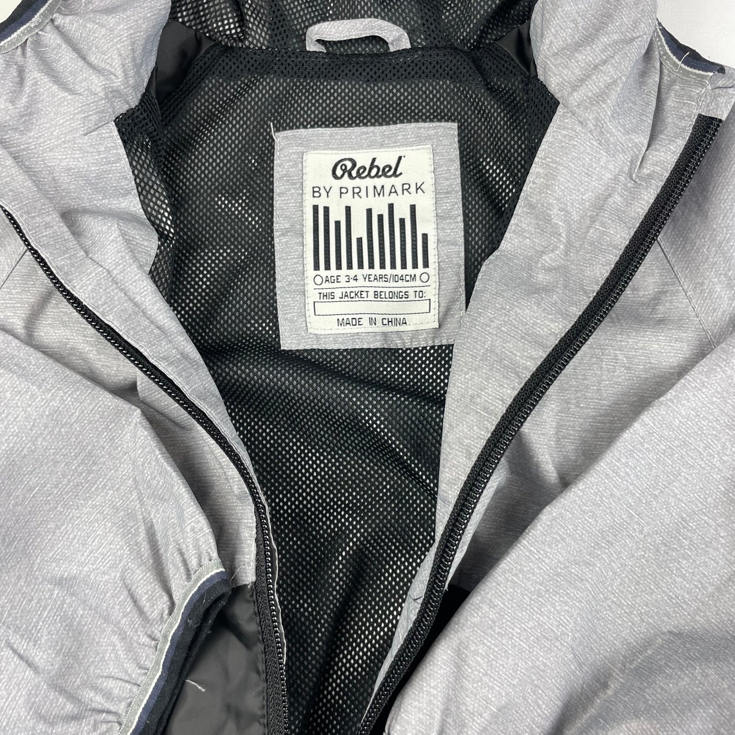 Graue Polyester-Regenjacke mit Kapuze für Kinder – inside