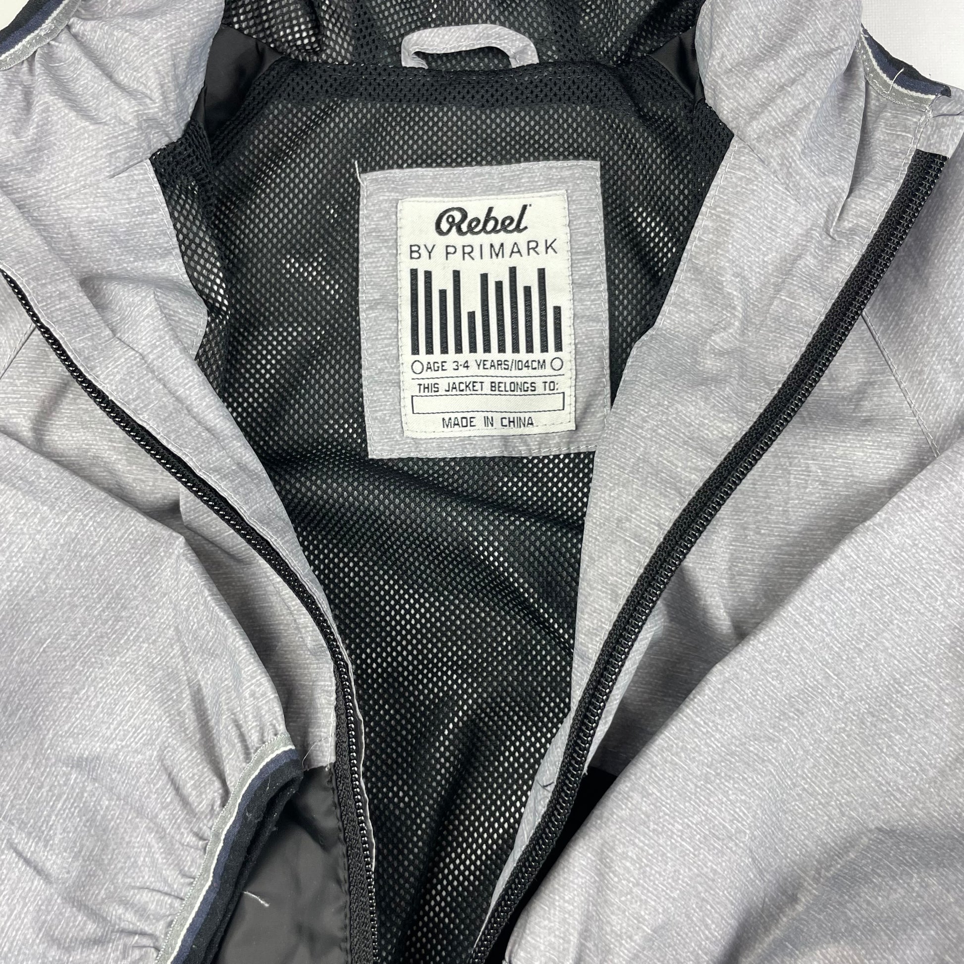 Graue Polyester-Regenjacke mit Kapuze für Kinder – inside
