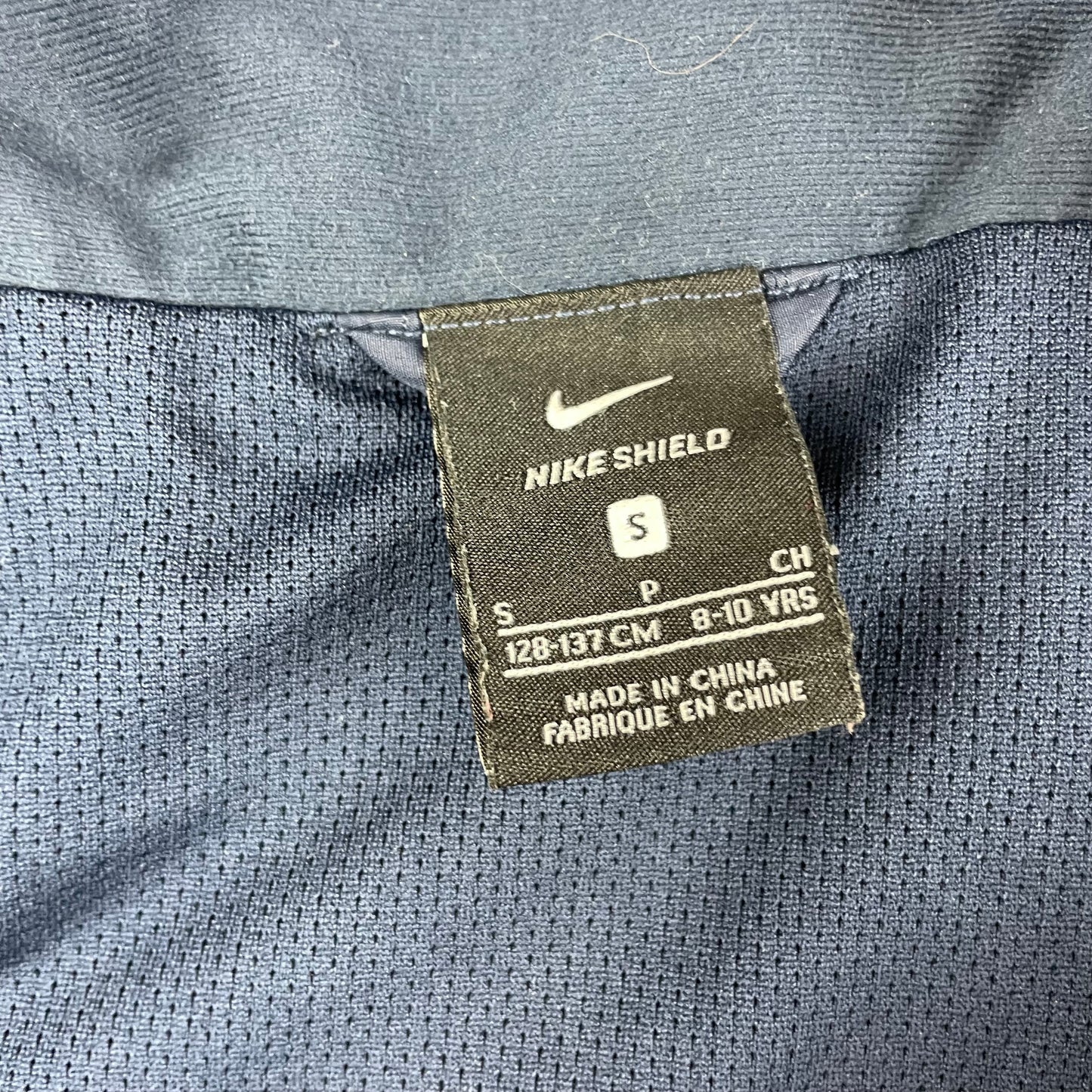 Dunkelblaue Regenjacke mit Kapuze von Nike für Kinder – label