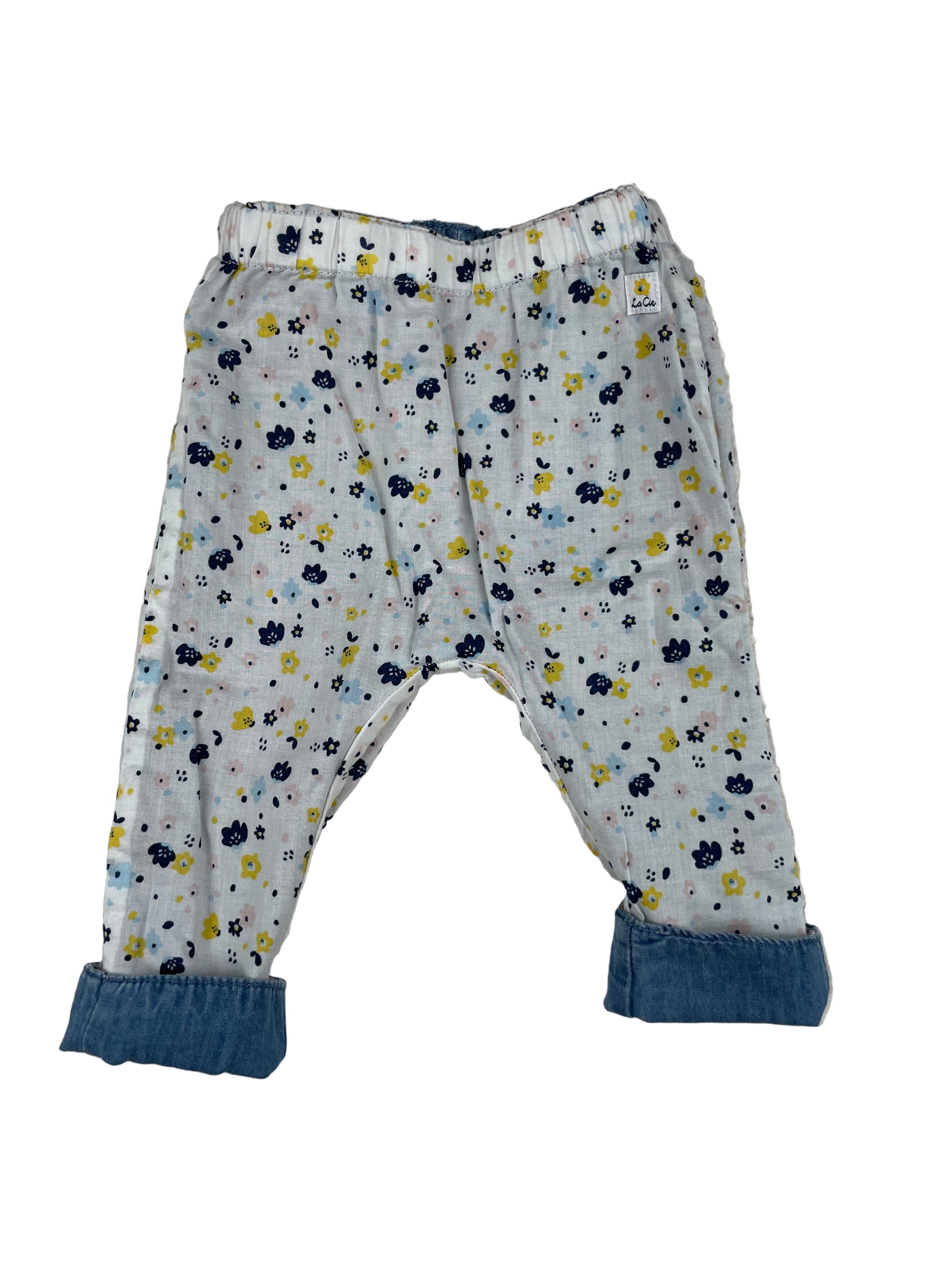 Mädchen-Wendehose, eine Seite jeansblau mit Hundemotiv, andere Seite weiß mit Blumenmuster – inside