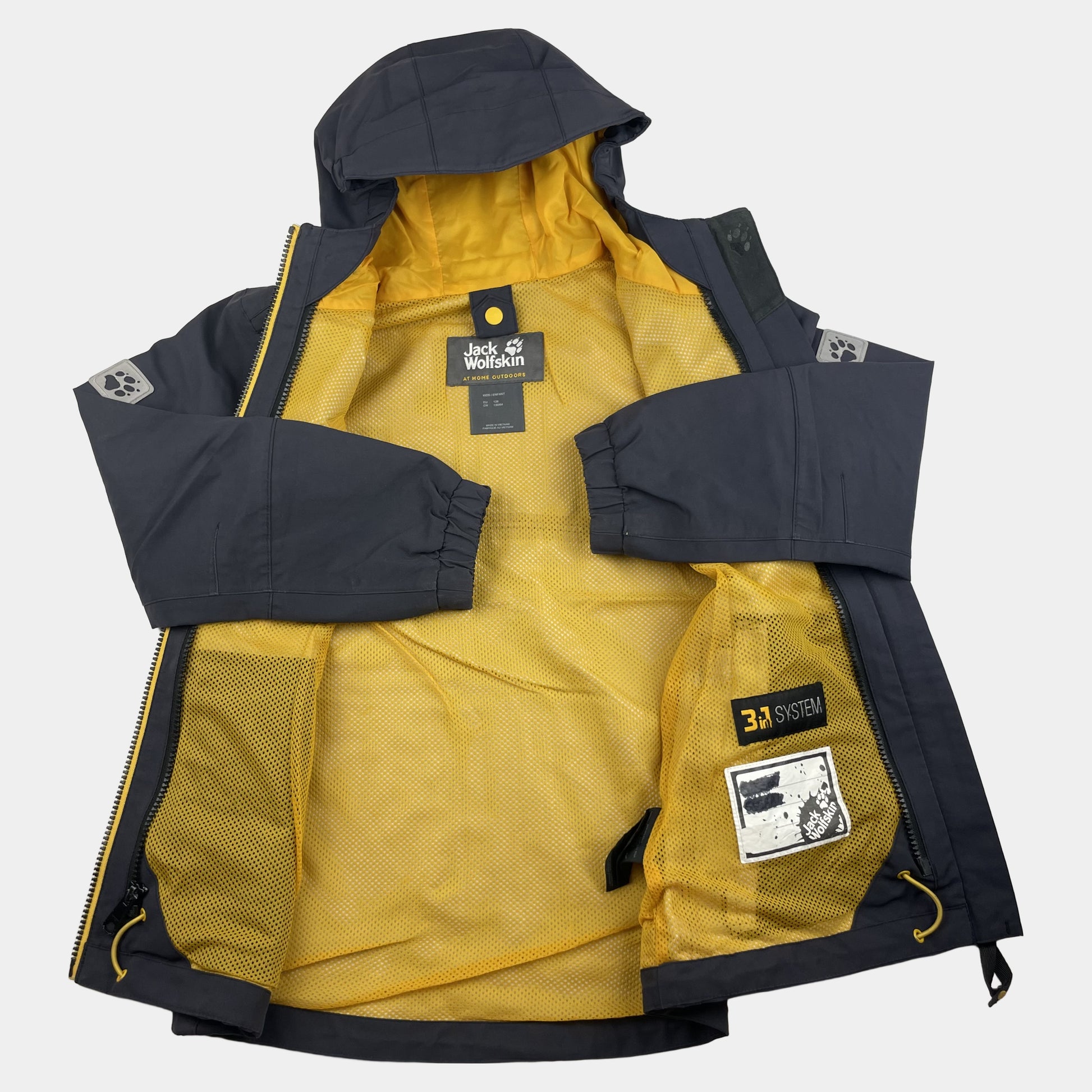 Graue Jack Wolfskin Kinderjacke mit gelbem Futter, Größe 128 – inside