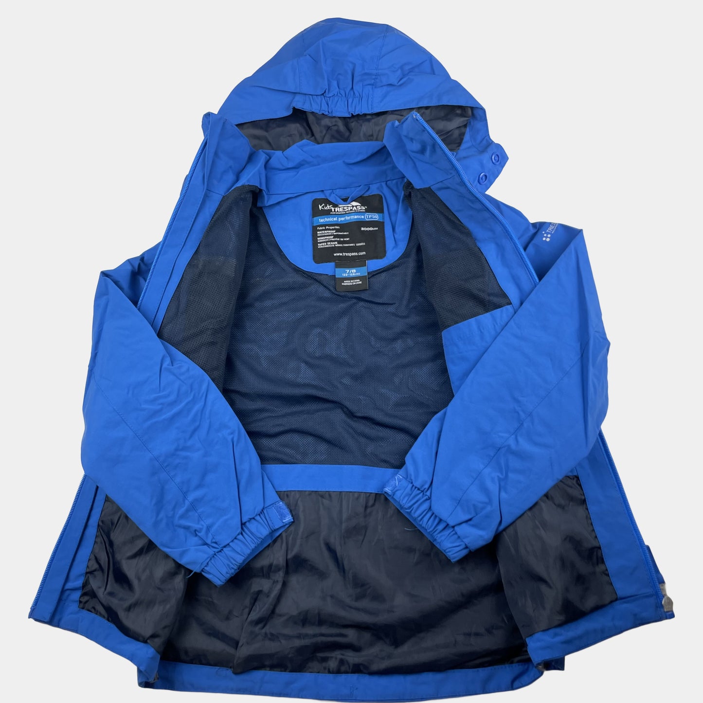 Blaue wasserdichte Kinderjacke von Trespass in Größe 122/128 – inside