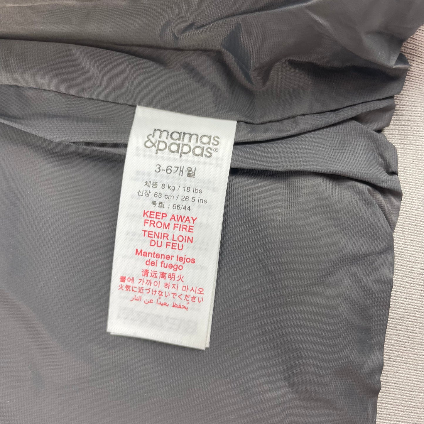 Graue Steppweste mit Kapuze – label