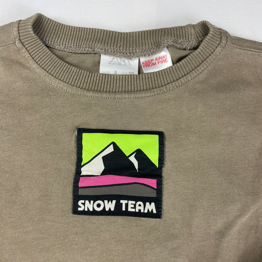 Beiger Pullover mit Snow-Team-Logo für Kinder – detail
