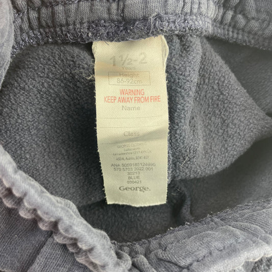 Blaue Freizeithose aus Baumwolle mit elastischem Bund und gerippten Bündchen. – label