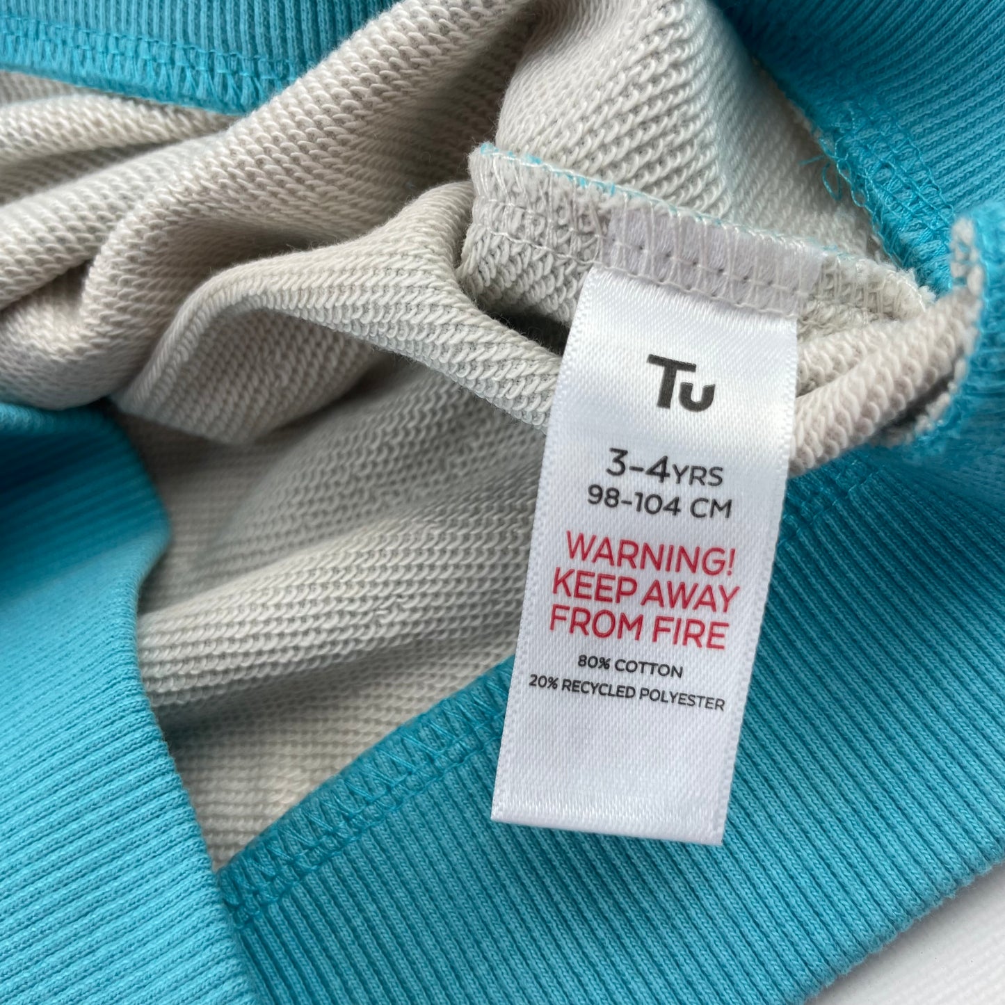 Blau-weißer gestreifter Pullover mit orangefarbener Tasche für Kinder – label
